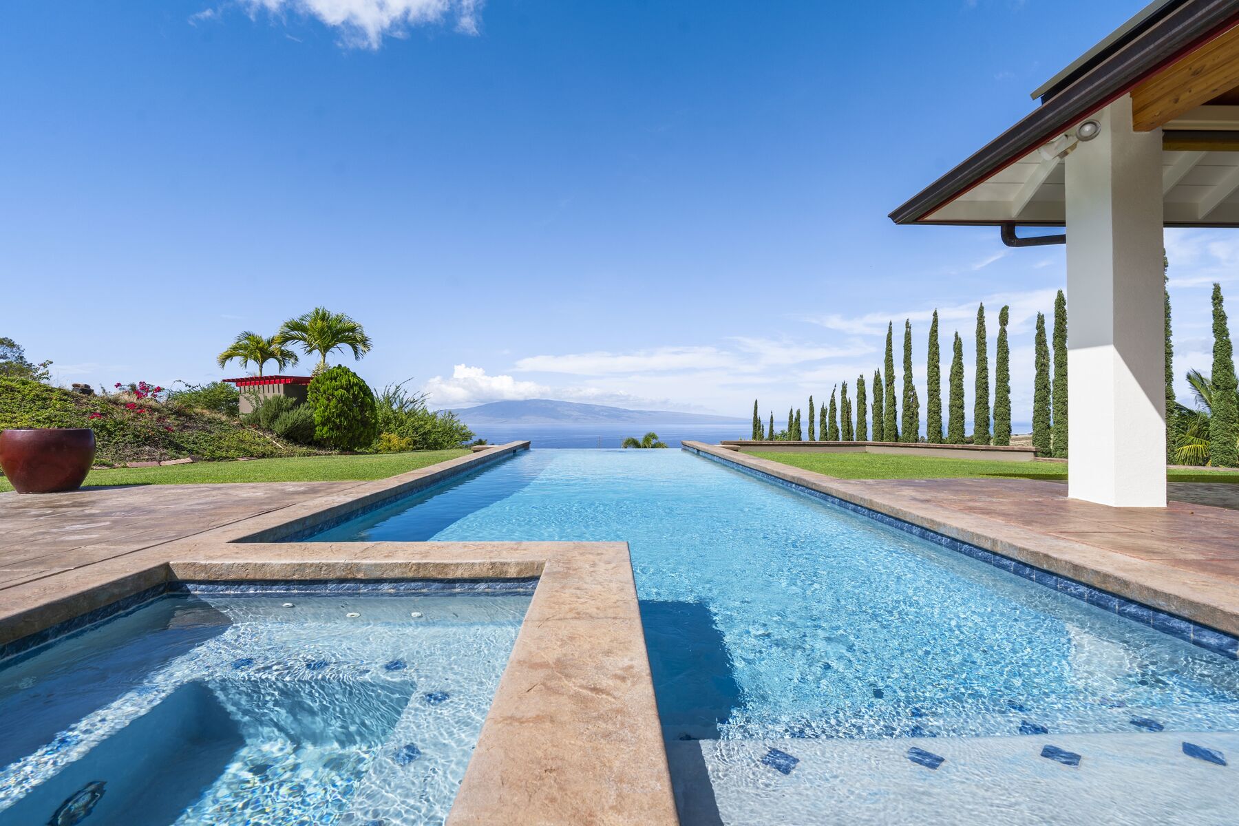 Pool and spa running to the ocean horizon