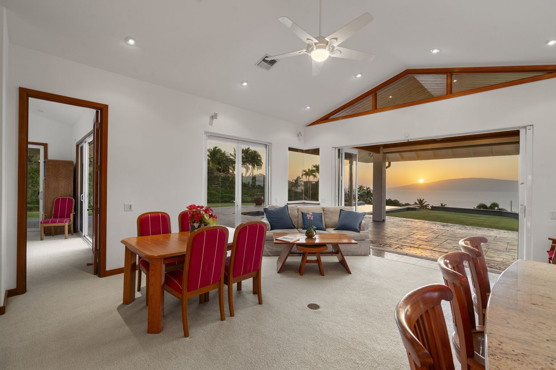 Great room and dining area opening to the sunset