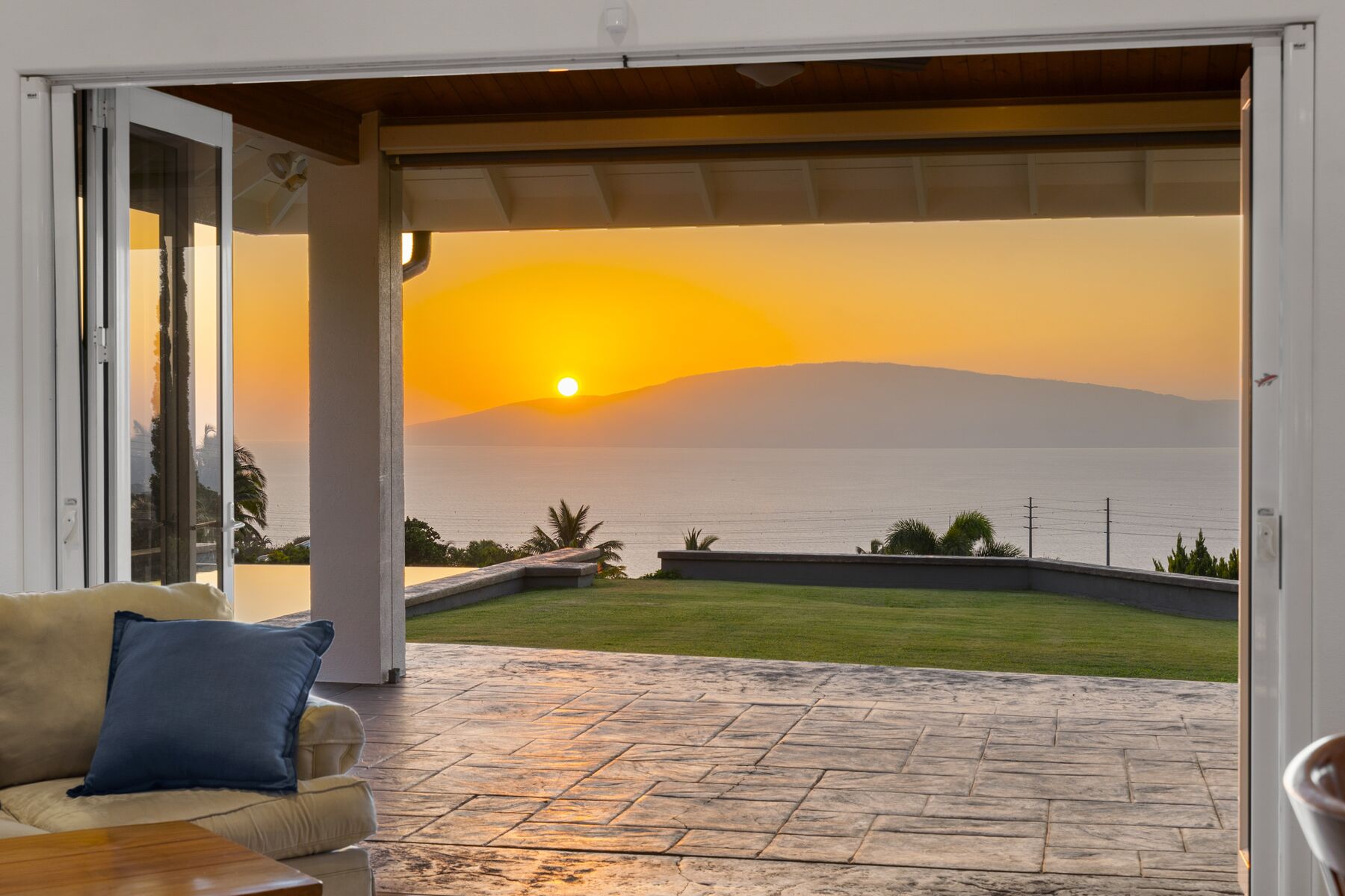Sunset over Lanai through the folding glass